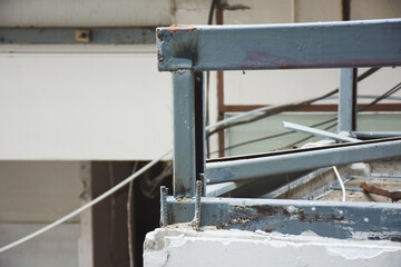 Metal framework and debris on a partially demolished building