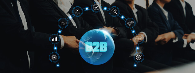 A diverse business team in professional attire gathers to discuss B2B strategies, symbolized by a globe, highlighting global partnerships and innovative solutions. Trope