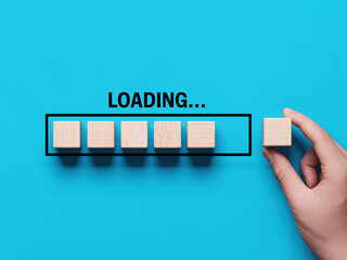Concept of loading with wooden blocks showing progress, perfect for technology and business presentations or website design materials