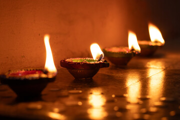 Row of colorful oil lamp prepared for the celebration of Karthigai deepam in Tamil nadu