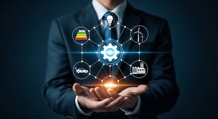 Businessman presenting an energy production concept with wind turbine, solar panel, car, factory, and light bulb icons in his hands