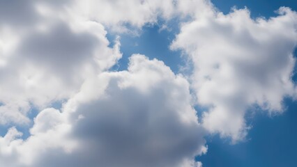 Obraz premium Fluffy White Cumulus Clouds in a Bright Blue Sky.
