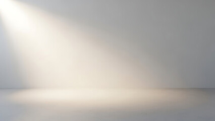 Soft light illuminating an empty room with a spotlight effect casting shadows on the floor and wall, creating a calm and serene ambiance