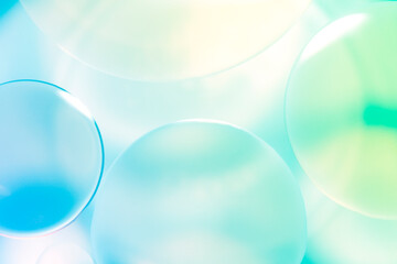 Soft Colorful Bubbles with Light Reflections on a Blue Background