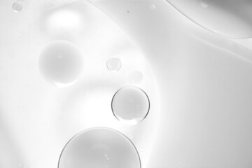 Clear Water Drops on White Surface with Soft Focus Background