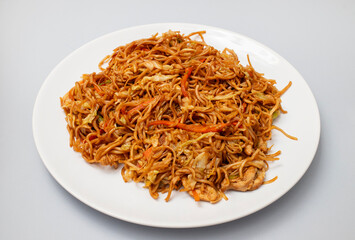 Chicken, pepper, and vegetables noodles on plate