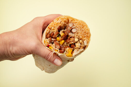 Traditional Mexican Food - Burrito, in hand