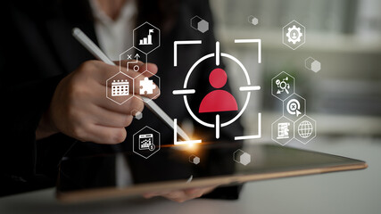 This image depicts a modern business scenario illustrating user identification and data analysis through digital icons on a tablet in a professional office. Gantry