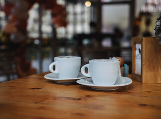 Two cups of coffee in morning cafe