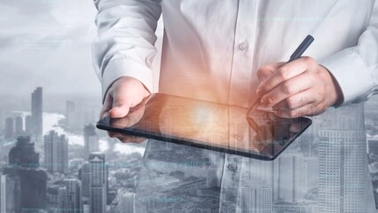 A business professional engages with a digital tablet for data analysis, surrounded by a stunning urban skyline, showcasing the blend of technology and modern business solutions. Xenic