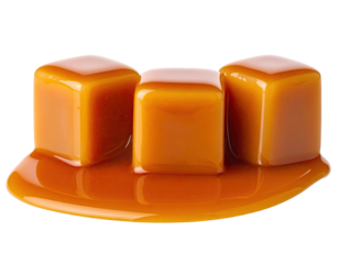 Three glistening, cube-shaped treats, nestled in a pool of golden, liquid confection