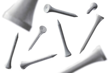 Several floating golf tees isolated from background