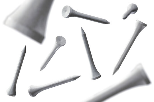 Several floating golf tees isolated from background