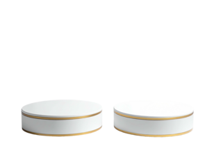 Two minimalist, white circular pedestals with gold accents on a stark black background