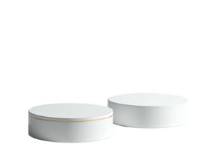 Two white cylindrical platforms, one with a gold band, isolated on a black background