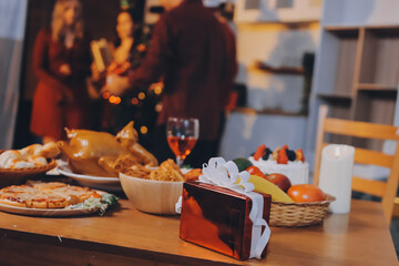 Festive Office Christmas Party with Delicious Food. A beautifully decorated office space with Christmas trees and festive lights, set up for a holiday party.