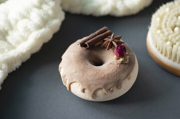 Handmade aromatherapy bath bomb with soft spa towels and brush