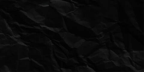 Black crumpled paper texture with folds, black background, Dark paper background with chaotic bends.