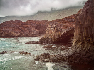Volcanic stone cliffs in the area of ​​the Golfo, El Hierro Island, Canary Islands