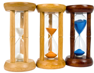 Three wooden framed hourglasses with colored sand, representing time's passage