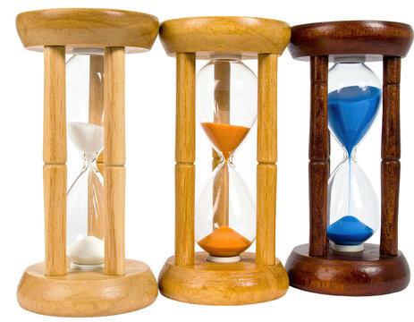 Three wooden framed hourglasses with colored sand, representing time's passage