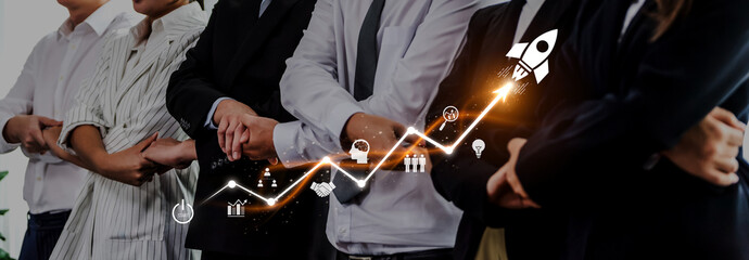 A diverse group of business professionals stands confidently with arms crossed, symbolizing unity...