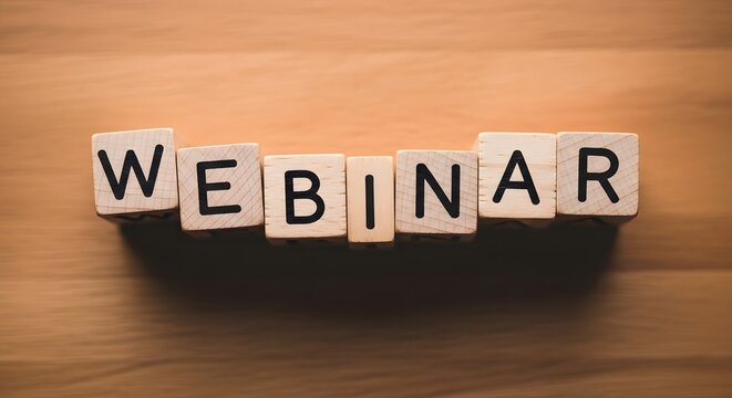 Wooden Blocks Spell Out the Word Webinar on a Wood Grain Surface online event education