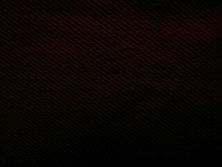 dark carbon fiber texture with diagonal stripes in black and reddish brown tones