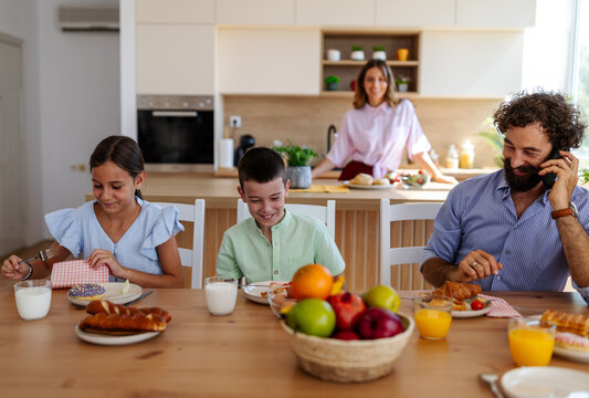 Family enjoys breakfast together in a kitchen