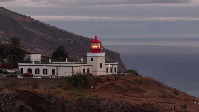 Ponta do pargo lighthouse shines as evening falls over Madeira Portugal