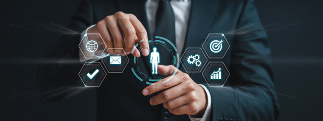 A group of business professionals in suits participates in a corporate meeting, surrounded by digital icons symbolizing networking and teamwork concepts. Trope