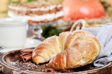 French croissant on a wooden tray.