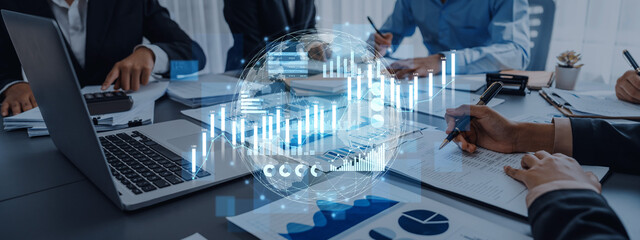 A modern business meeting scene showcasing professionals discussing financial growth and data analytics with charts, graphs, and technology on display. Scalp