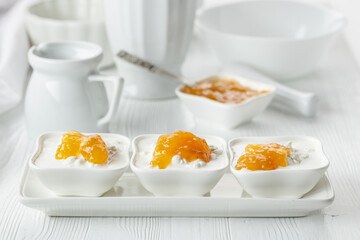 Cottage cheese with cream and apricot jam.