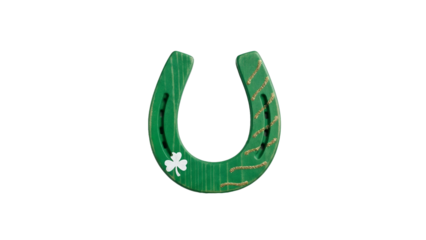 Wooden horseshoe painted green with clover decoration, , minimal festive detail for St. Patrick’s Day,  isolated on white background with copy space for concept