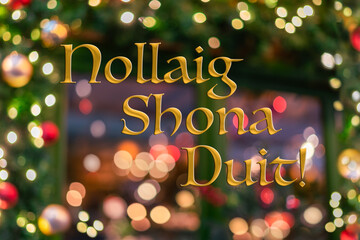 "Nollaig Shona Duit" Merry Christmas in Irish. Blurred green irish color background of decorated Christmas tree branche. Irish pub background. Bokeh. Celebration 25 December. Greeting postcard Ireland