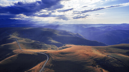 A panoramic view of the winding mountain road to the Dzhily Su tract. Autumn. Drone footage.