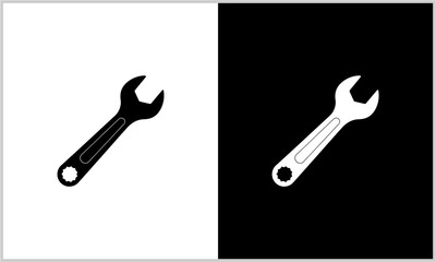 Two contrasting graphic icons of a single-ended wrench, one black on white and one white on black, representing a common hand tool.