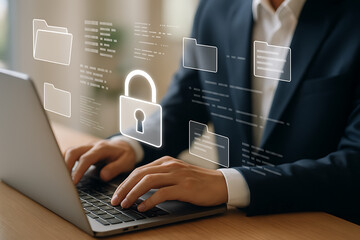 Business professional working on laptop with glowing holographic lock and folders representing secure file protection and cybersecurity system