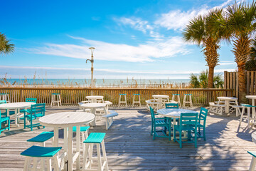 A beachfront outdoor cafe along the Grand Strand coast of the Atlantic Ocean at Myrtle Beach, South Carolina, USA.