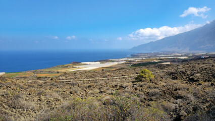 Volcanic landscape meeting Atlantic Ocean with coastal agriculture, Valley of El Golfo, Island El Hierro, Canary Islands, Spain, Europe.