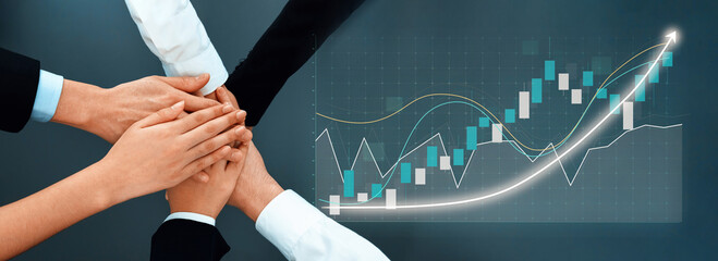 A powerful representation of teamwork with hands united over a digital screen showcasing financial growth, symbolizing partnership and collective effort in business success. Axiom