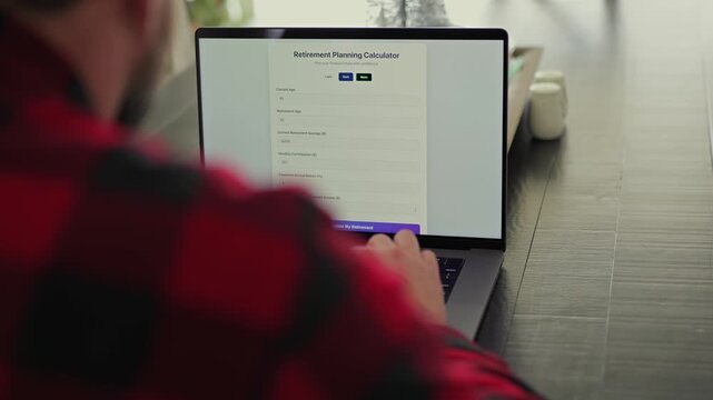 Middle Aged Man Using Retirement Calculator App at Kitchen Table Finding Savings Underestimated Funds Required to Financially Survive Concept