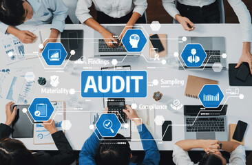 A dynamic scene showing business professionals engaging in audit analysis, utilizing data charts and technology tools to enhance collaboration in a modern workspace. Amity