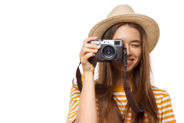 Close-up portrait of happy smiling young female photographer, tourist holding photo camera