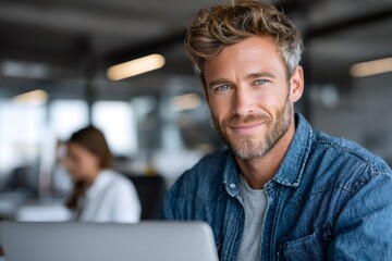 Smiling confident businessman working in modern office environment