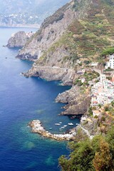 Naklejka premium Coast and town of Riomaggiore in the Cinque Terre area, Italy.