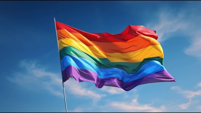 LGBT flag waiving, blue sky background