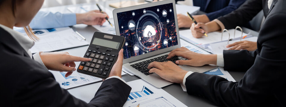 Business intelligence and data analysis concept. Analyst team working on financial data analysis dashboard on laptop screen as marketing indication for effective business strategic planning. Insight