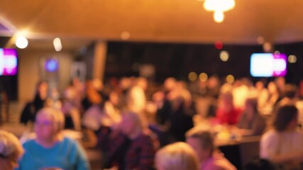 Crowd warmly shows gratitude, Spectators comfortably seated cheer loudly expressing their enjoyment